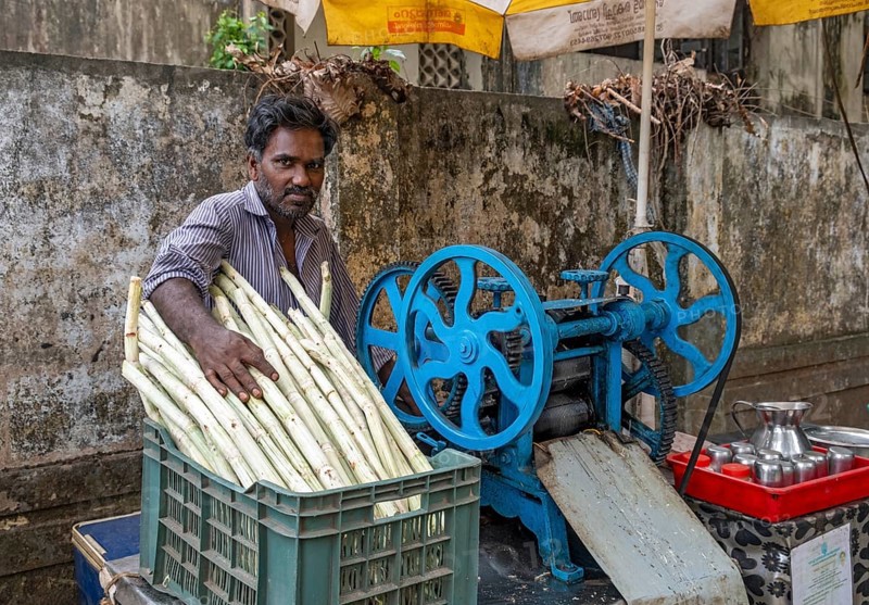 Portrait of street vendor of sugar cane juice
