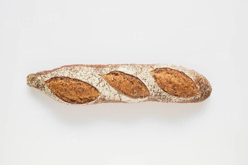 Whole rustic baked baguette white background