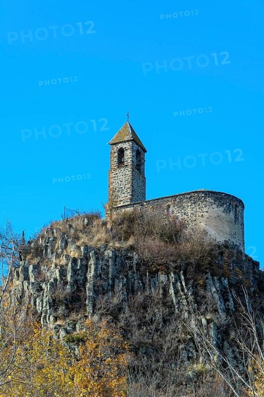 View from below of Brionnet chapel around Saurier village on volcanic peak