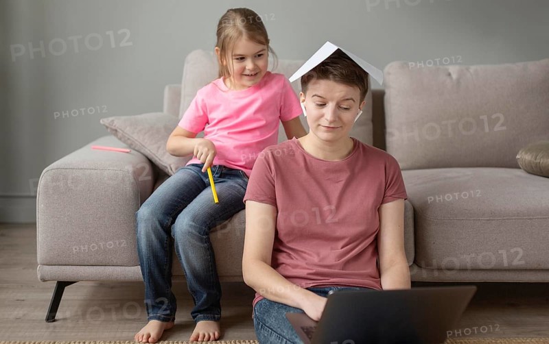 Medium shot parent working home