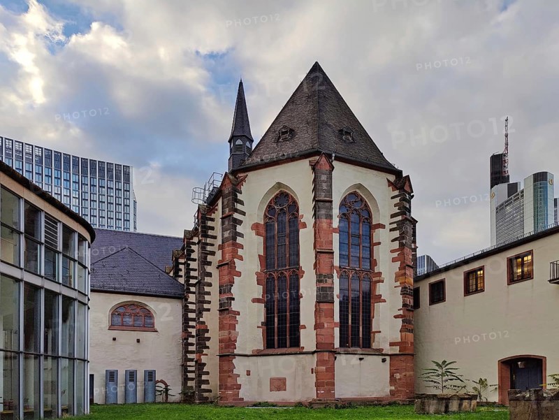 Old Carmelite monastery in front of modern skyscrapers in the banking district