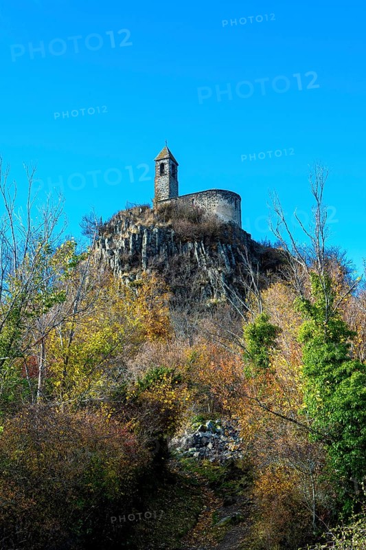View from below of Brionnet chapel around Saurier village on volcanic peak