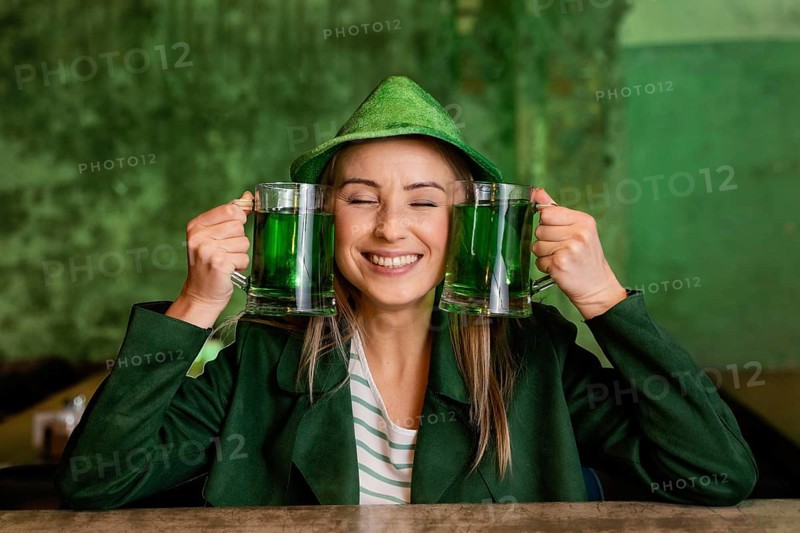 Front view smiley woman with hat celebrating st patrick s day bar