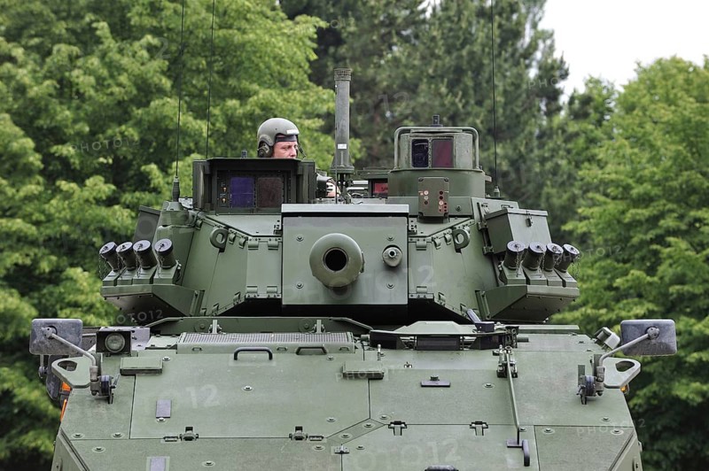 Commander in turret of MOWAG Piranha IIIC armoured fighting vehicle of the Belgian army