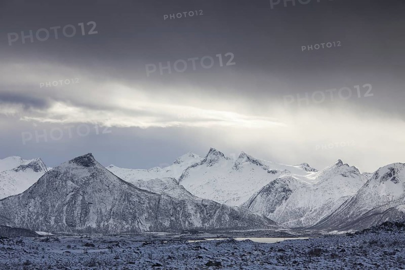 Lake and snow covered mountains in winter