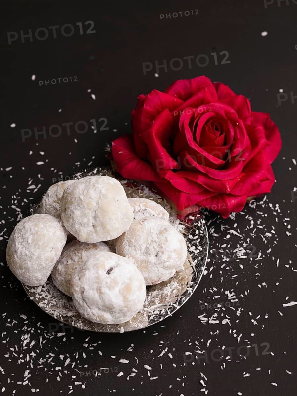 Top view islamic pastries with red rose