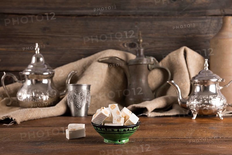 Turkish delight with teapots wooden table