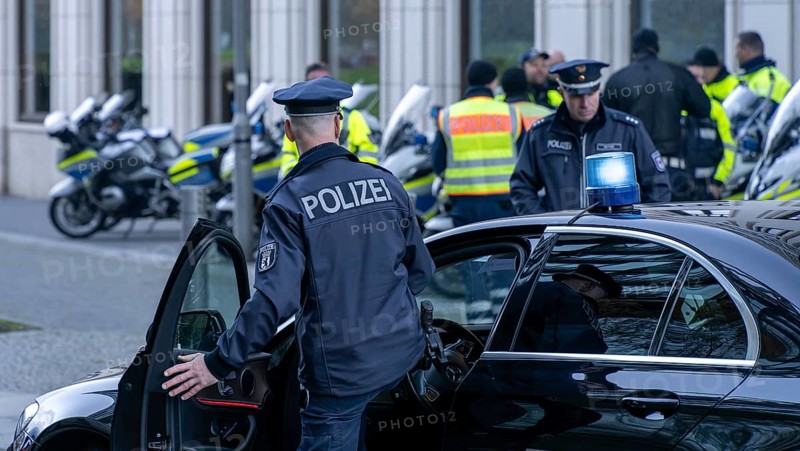 Police with yellow high-visibility waistcoats