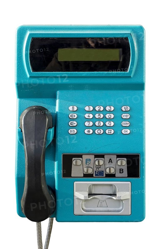 Old public payphone to be used with pre-payment card only in telephone booth from telecom provider against white background
