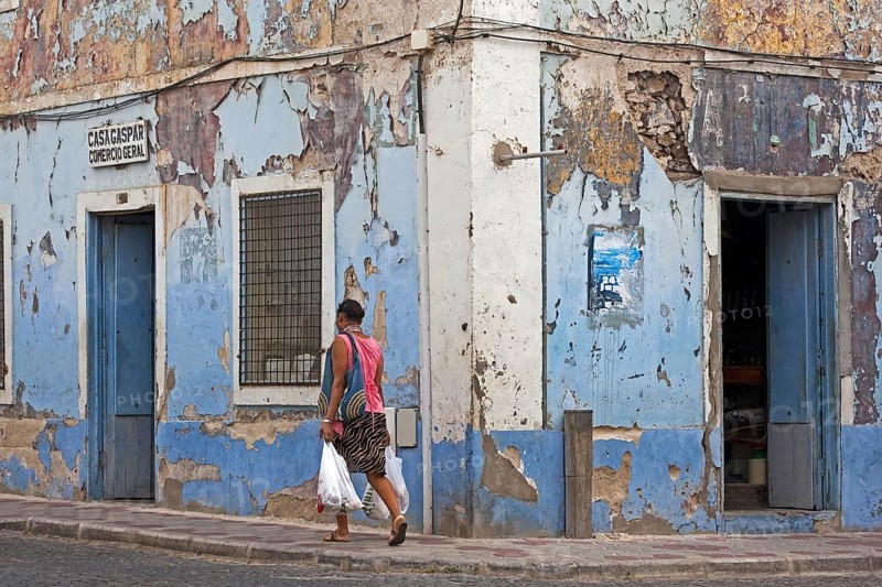 Paint flaking off house fronts of old colonial buildings in the historic center of the city Mindelo on the island Sao Vicente