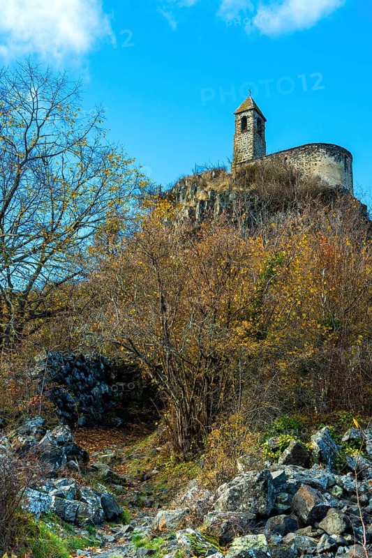 View from below of Brionnet chapel around Saurier village on volcanic peak