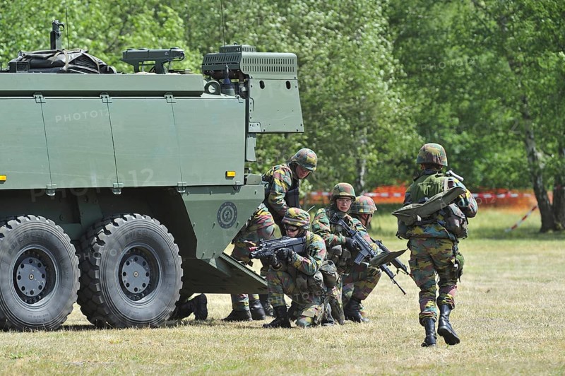 Demonstration of infantry soldiers fighting near MOWAG Piranha IIIC armoured fighting vehicle during open day of the Belgian army at Leopoldsburg