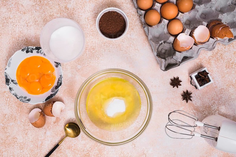 Various type ingredients making baked cake textured backdrop