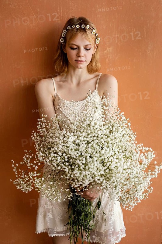 Woman posing with bouquet beautiful flowers