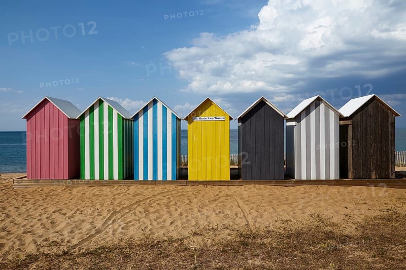 Colourful bathing houses on the beach at La Bree-les-Bains