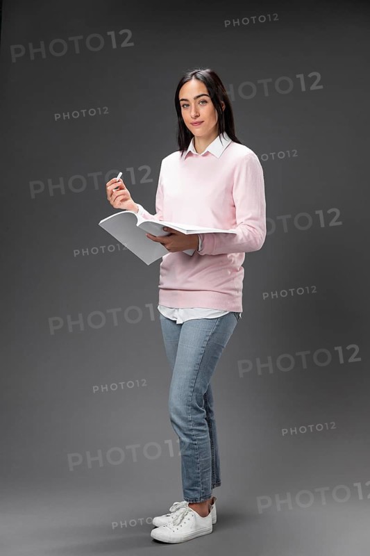 Portrait teacher female holding book_3