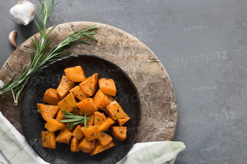 Top view sweet potatoes black plate