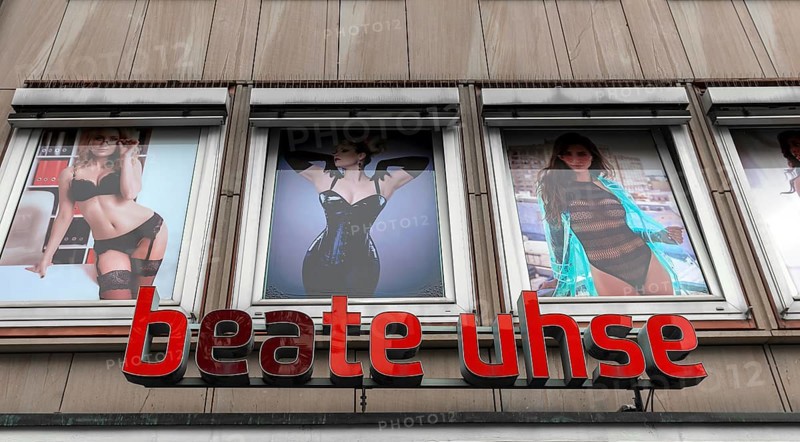 Logo Beate Uhse with advertising posters