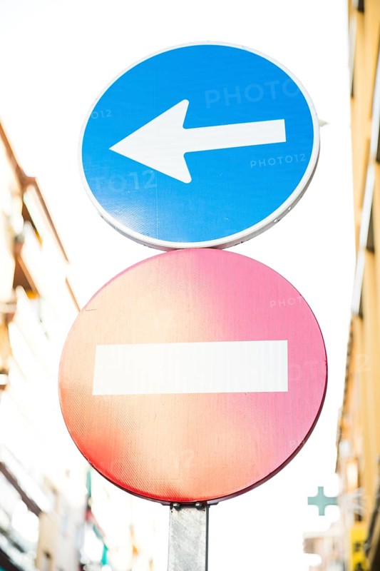 Red stop street sign directional sign road