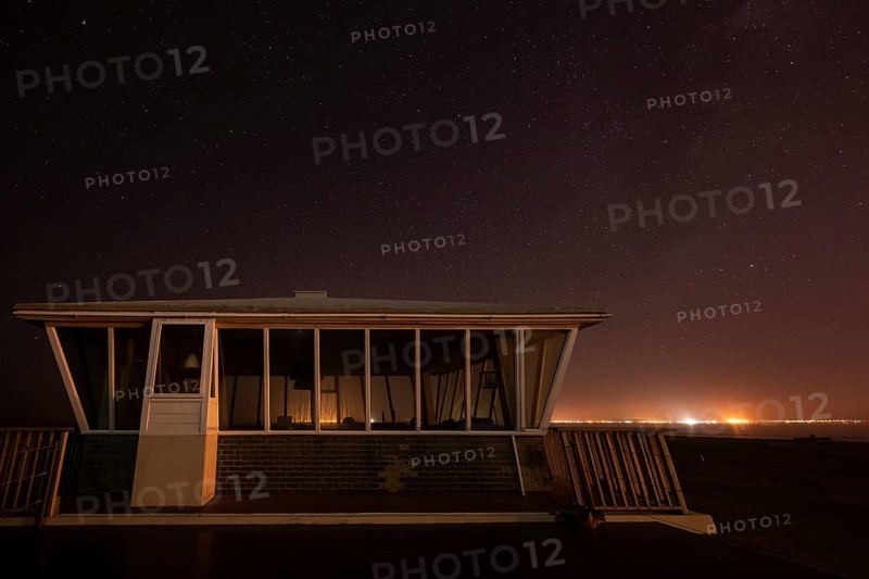 Pelican Point lighthouse with starry sky