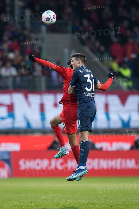 Keven SCHLOTTERBECK VFL Bochum in aerial battle with Eren DINKCI 1. FC Heidenheim li