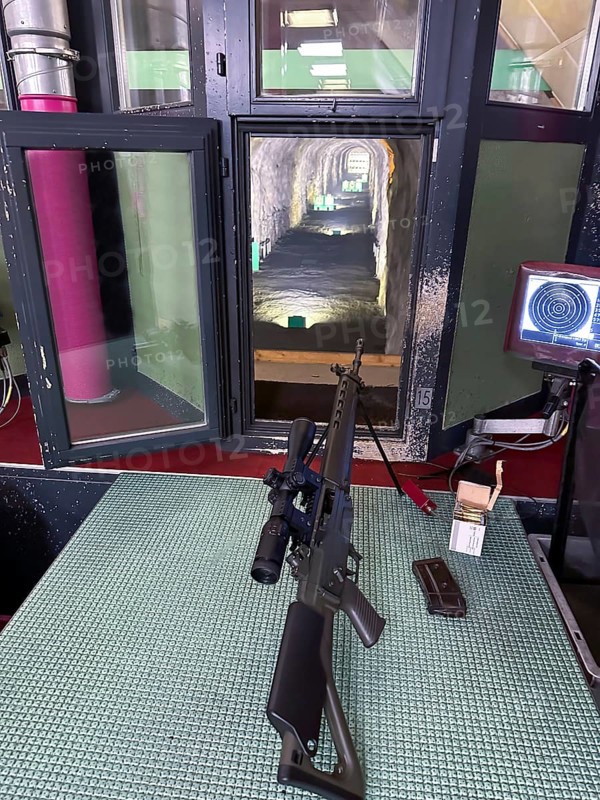 Modern 300 Meters Shooting Range with an Assault Rifle in an Illuminated Underground Tunnel in Switzerland