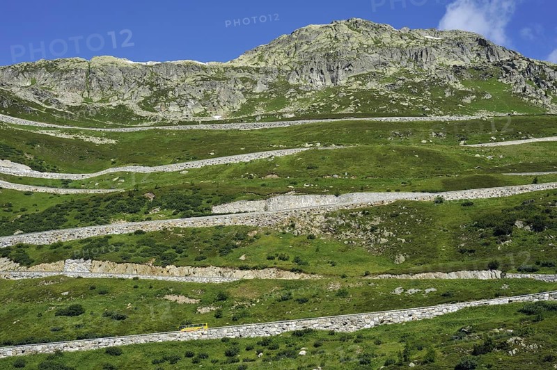 Road with hairpin curves winding over the Grimsel Pass in the Swiss Alps