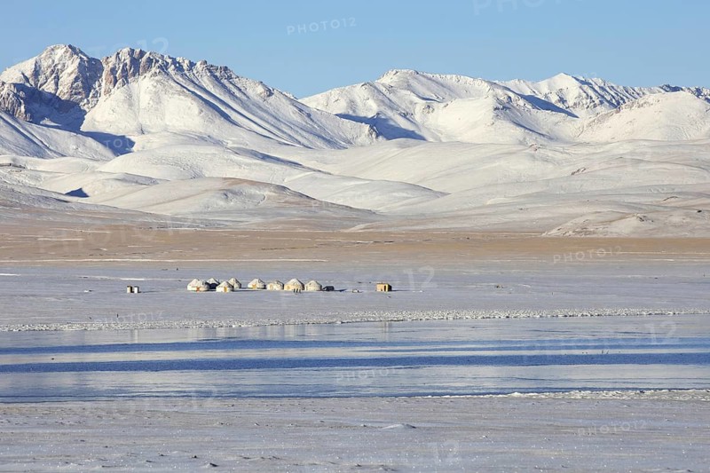 Yurts in traditional Kyrgyz yurt camp in the snow along Song Kul