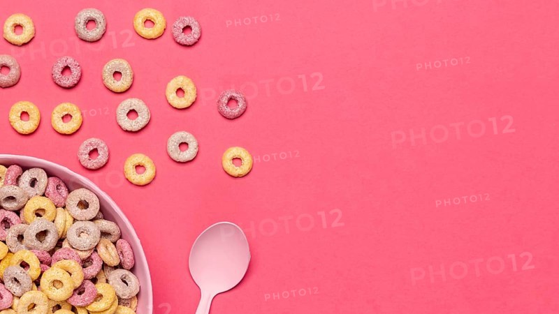 Bowl cereal fruit loops with spoon copy space