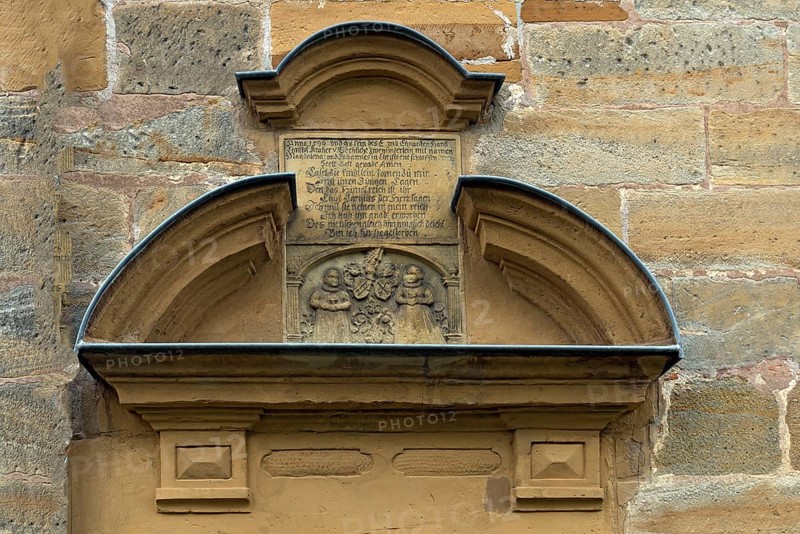 Former children's tomb with a poem above the side entrance of St Luke's Church