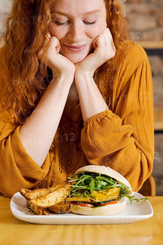 Close up smiley woman with food