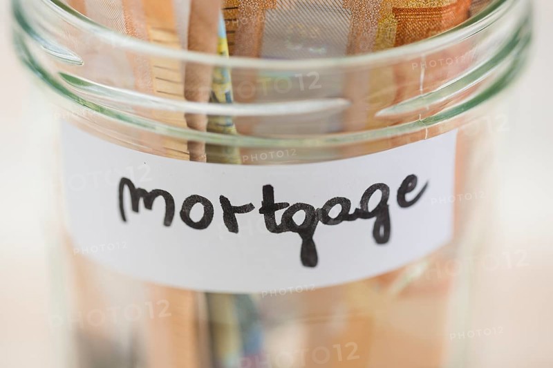 Euro notes saving mortgage glass jar