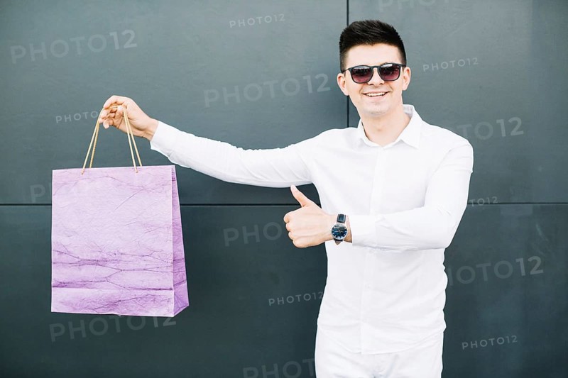 Guy sunglasses with shopping bag