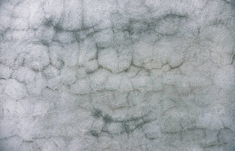 Cracked cement wall background. Textured and cracked wall. Textured old wall background. Texture of a gray wall. Old wall with cracked texture