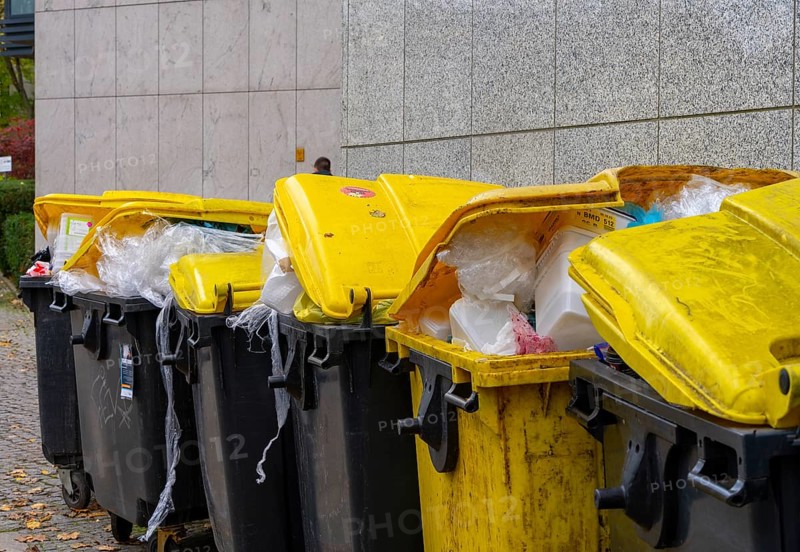 Dumpster overfilled with plastic film