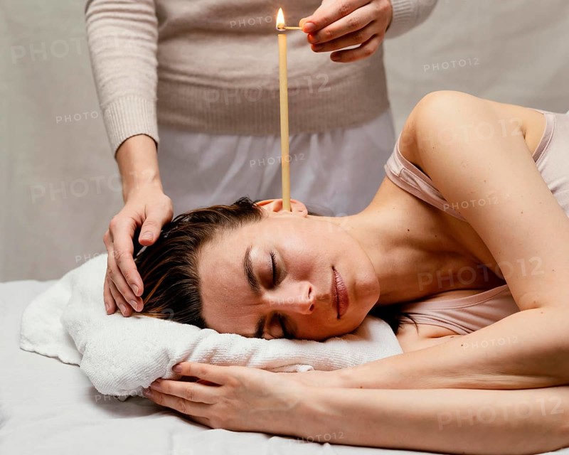 Close up therapist using candle