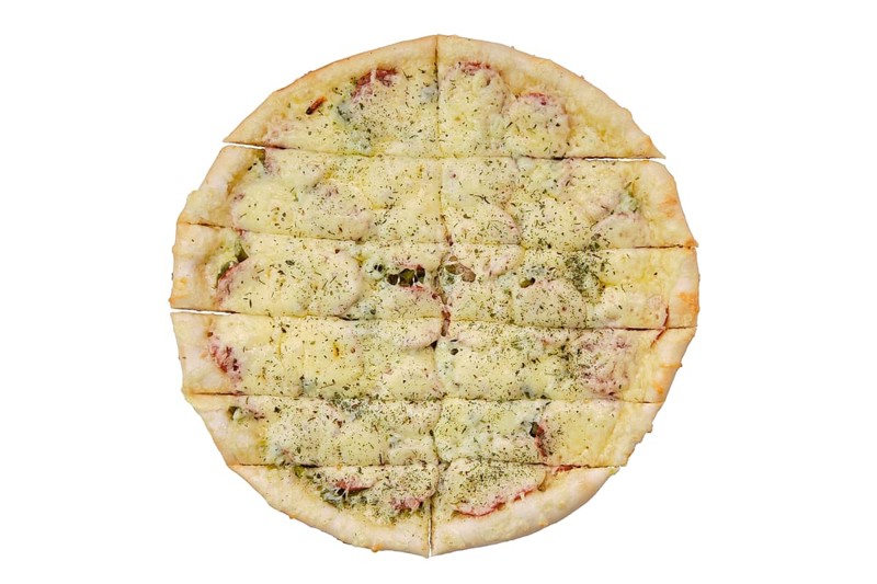 Top view of focaccia with sausage and pickled cucumber cut on stripes