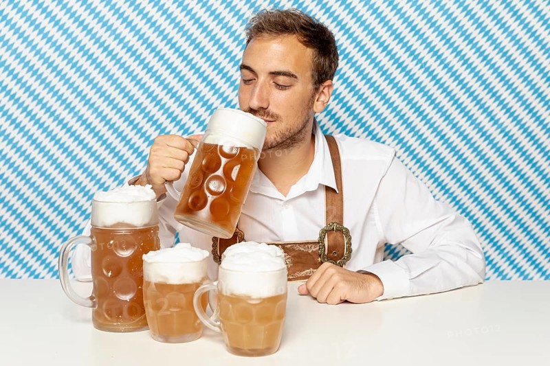 Front view man drinking blonde beer