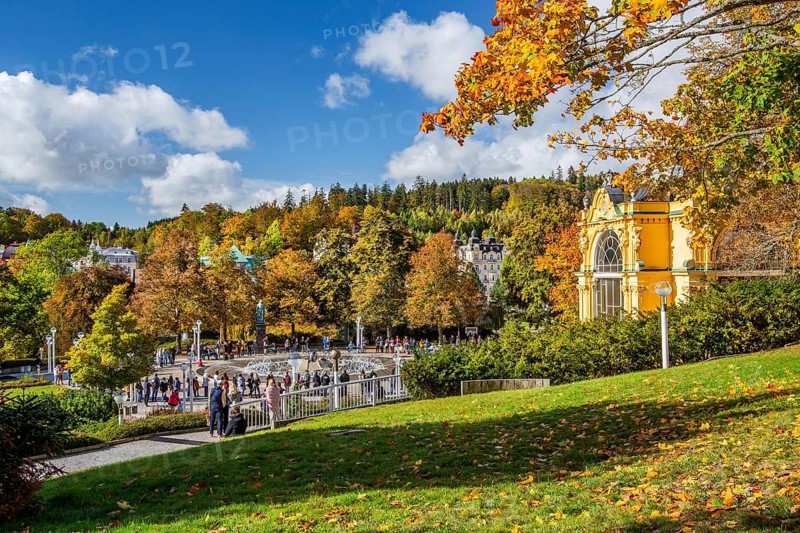 Spa colonnade with singing fountain in the autumnal spa park
