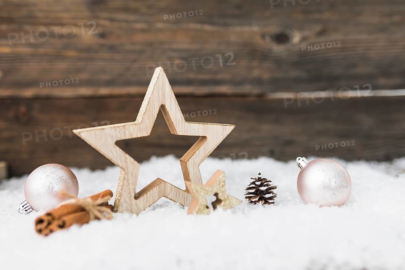 Christmas balls near wood articles snow