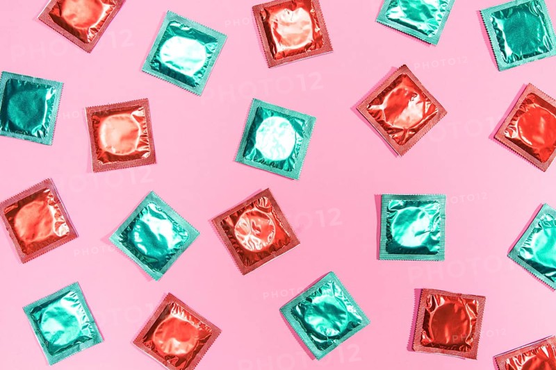 Flat lay condoms red green wrappers