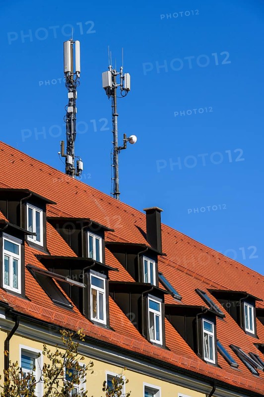 Rores tiled roof with dormers and antennas