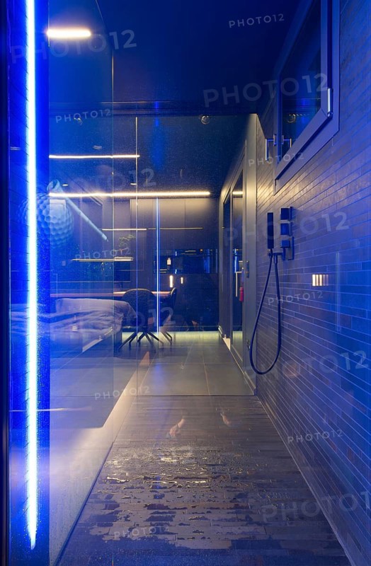 Modern Luxury Bathroom with Beautiful Design with View to Kitchen in Apartment in Switzerland