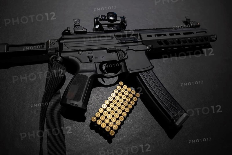 Modern Elegant Assault Rifle and Bullet on Grey Background in Switzerland