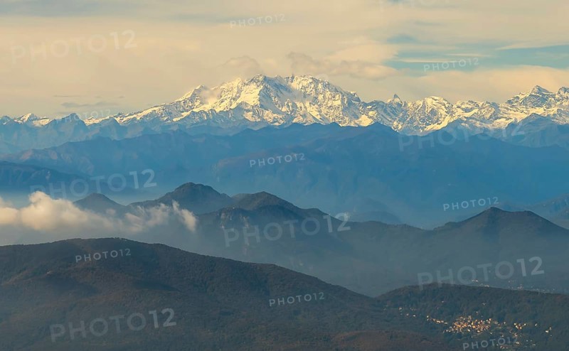 Aerial View over a Beautiful Mountainscape and And Snow Capped Monte Rosa and Mountain Peak Matterhorn and with Floating Clouds in a Sunny Day in Ticino