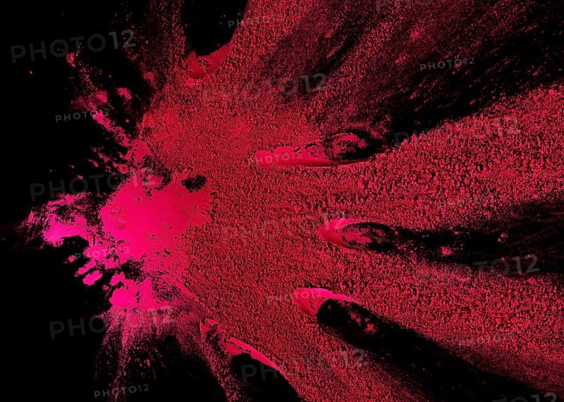 Abstract pink color powder explosion black backdrop