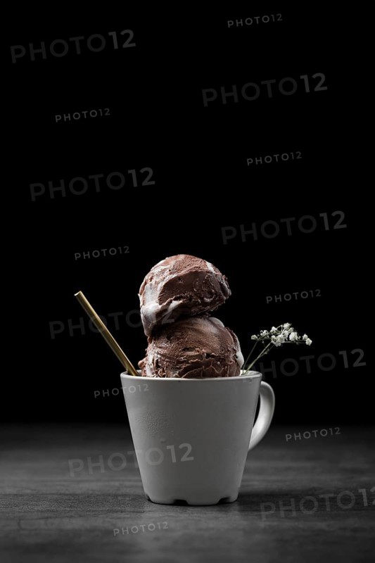 Cup with chocolate ice cream scoops