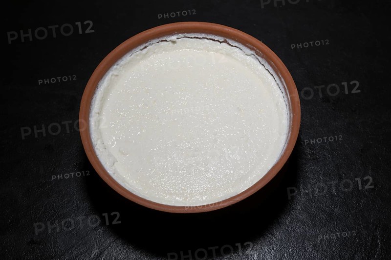 Original Turkish kaymakli yoghurt matured in a clay bowl