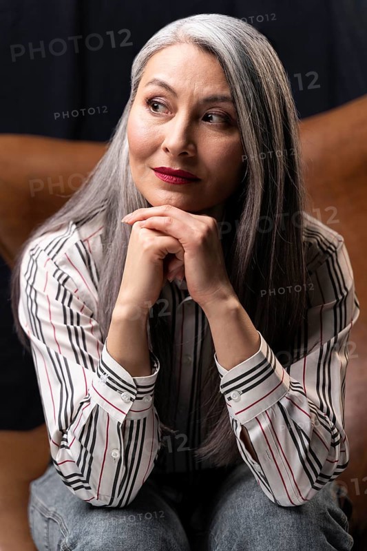 Beautiful senior woman portrait posing chair 2