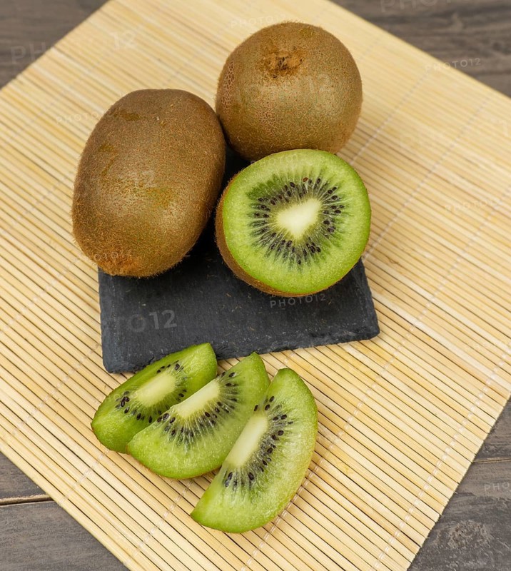 Fresh kiwis sliced on a plate